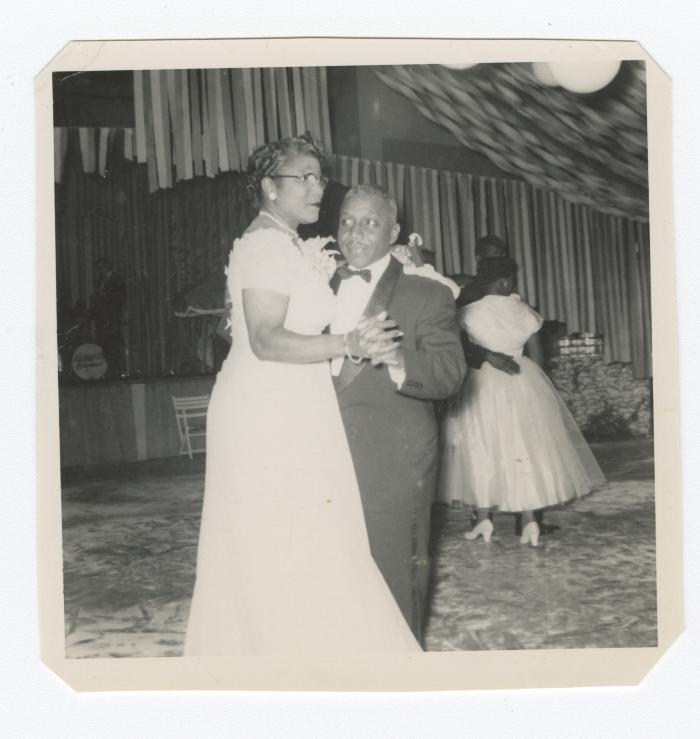 Mr. Elmer T. Hawkins and wife Marjorie Hawkins dancing at a gala