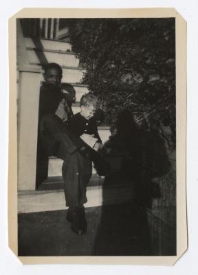Man and young boy sitting on a staircase