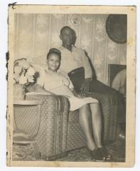 Man and woman sharing an armchair