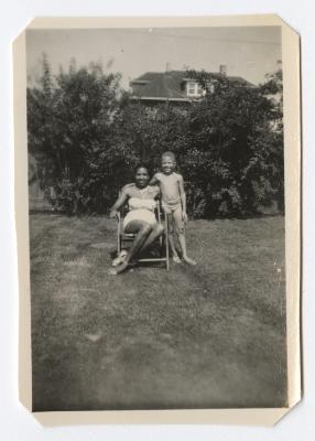 Woman and young boy posing in the backyard