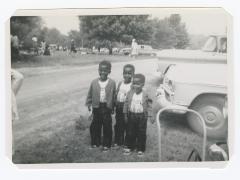 Three young boys in matching outfits