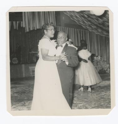 Mr. Elmer T. Hawkins and wife Marjorie Hawkins dancing at a gala