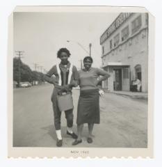 Sylvia Sparks and a friend posing while on a bus trip
