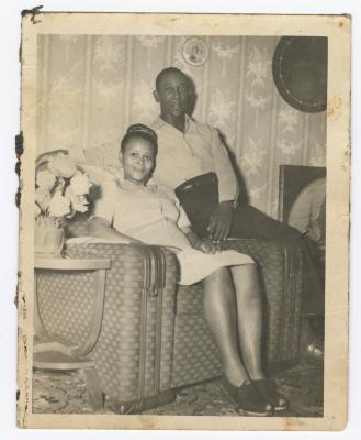 Man and woman sharing an armchair