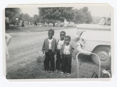 Three young boys in matching outfits