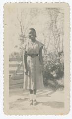 Shirley Dorsey posing in front of a fence