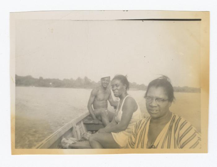 Three people canoeing