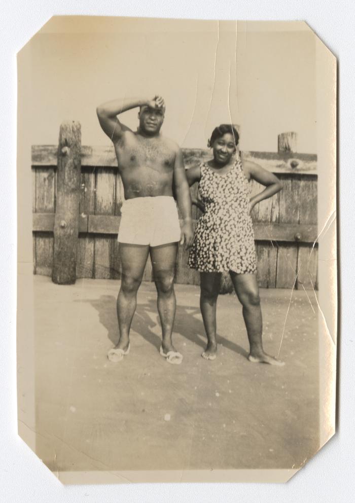 Man and woman standing on the beach