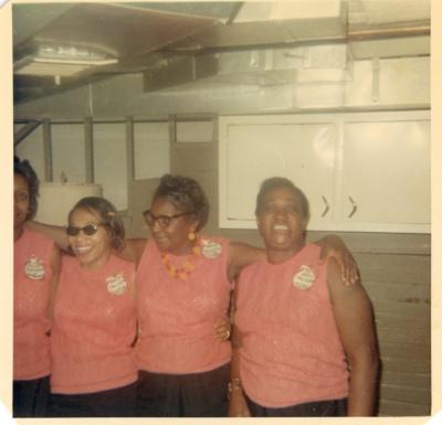 Four ladies in pink laughing