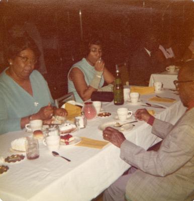 Women in teal at a banquet