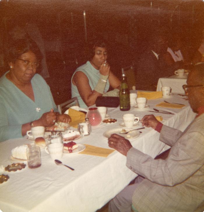 Women in teal at a banquet