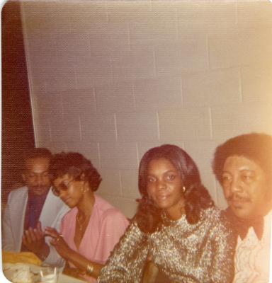 Four people seated at a table