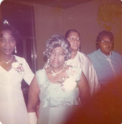 Four women formally dressed
