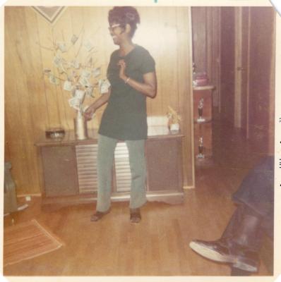 Woman standing next to a money tree