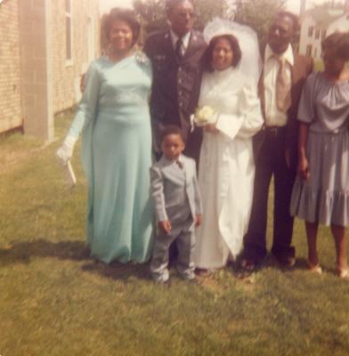 Wedding guests posing with bride