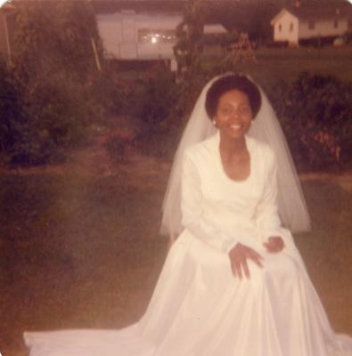 Bride seated outside