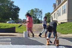 Children working on street mural