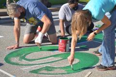Painting the "S" for the Black Lives Matter street mural