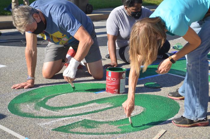 Painting the "S" for the Black Lives Matter street mural
