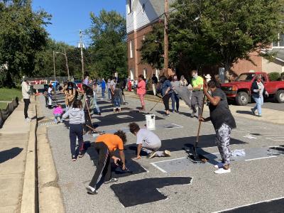 View of North College Avenue during the painting of the Black Lives Matter street mural