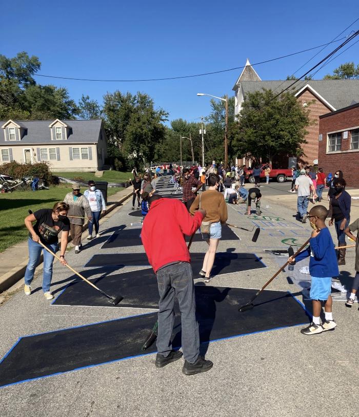Painting the Black Lives Matter street mural on North College Avenue