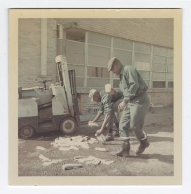 Harold Sisco and Joshua "Berkie" Fenwick pick up fish at VITA Foods 