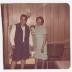Women posing in wood-paneled room