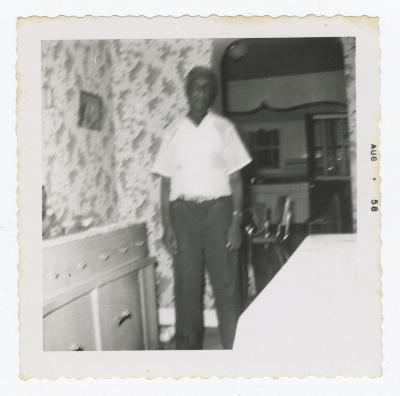 Blurry picture of a man in a dining room