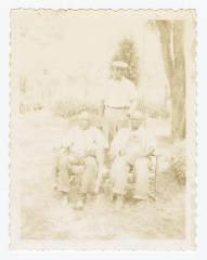 Three older men outside
