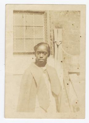 A teenage girl standing outside