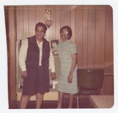 Women posing in wood-paneled room