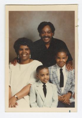 A family of four posed