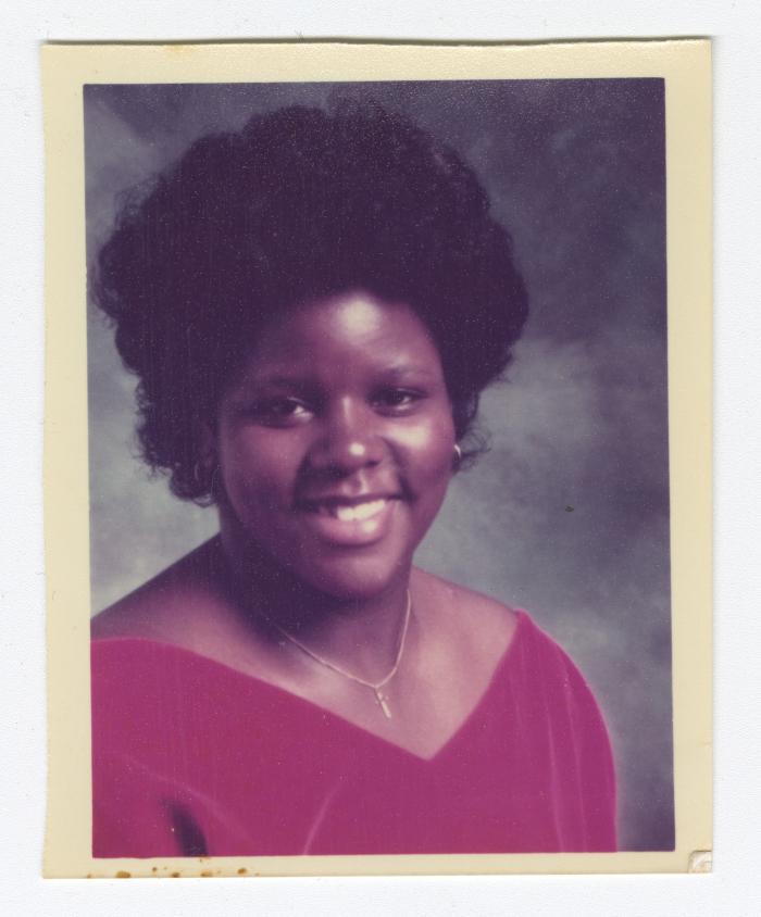 Portrait of a young woman in a pink shirt