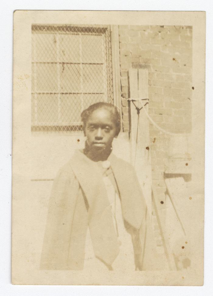 A teenage girl standing outside