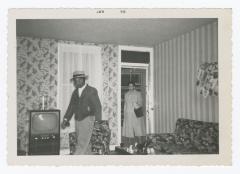 Two people entering a house