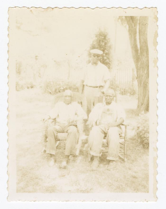 Three older men outside