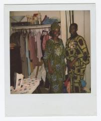 Two people in African patterned clothing 