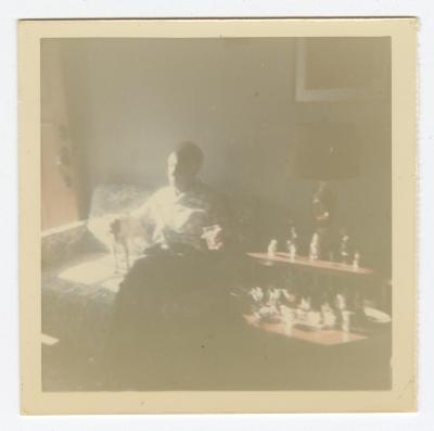 Blurry photograph of a man and a small dog