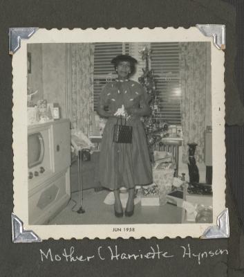 Mother Harriette Hynson standing in a living room