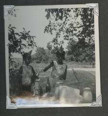 Two young girls at an outdoor birthday celebration