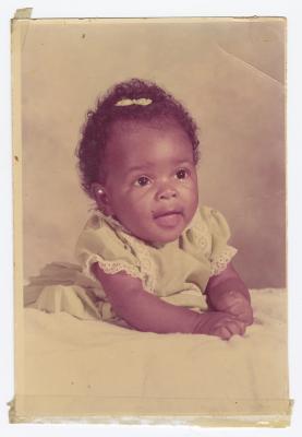 A young baby in yellow