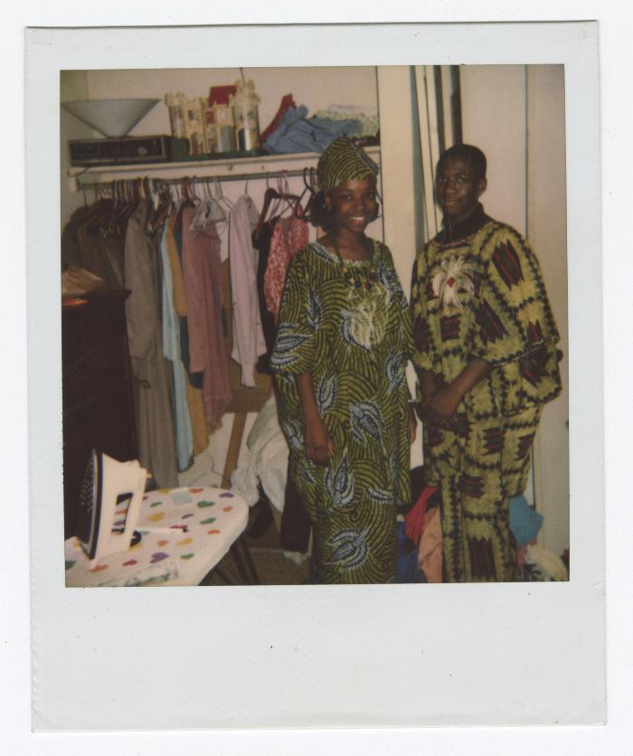 Two people in African patterned clothing 