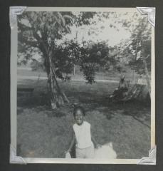 A young girl smiling widely
