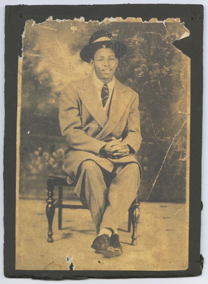 Young man in a large suit