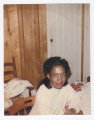 A young woman sitting at a table