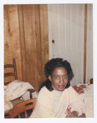 A young woman sitting at a table