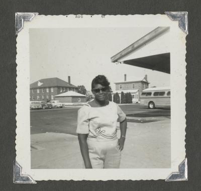 A woman posing outside