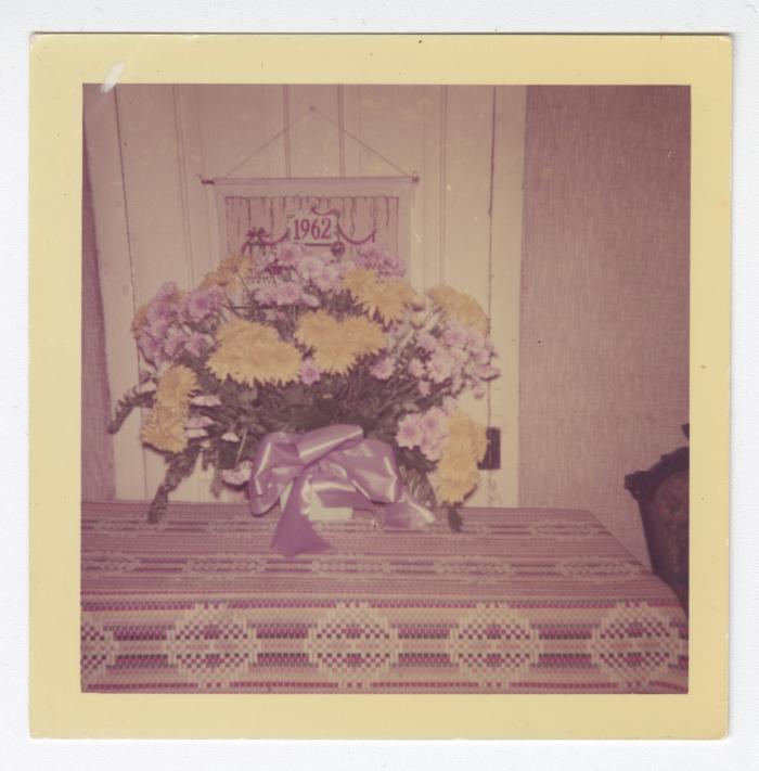 Purple and yellow flowers on a table