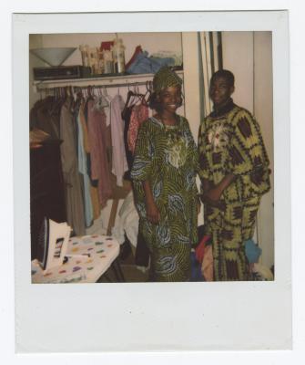 Two people in African patterned clothing 