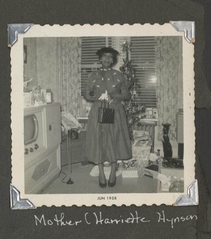 Mother Harriette Hynson standing in a living room